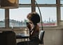 anonymous black female freelancer using laptop near dog